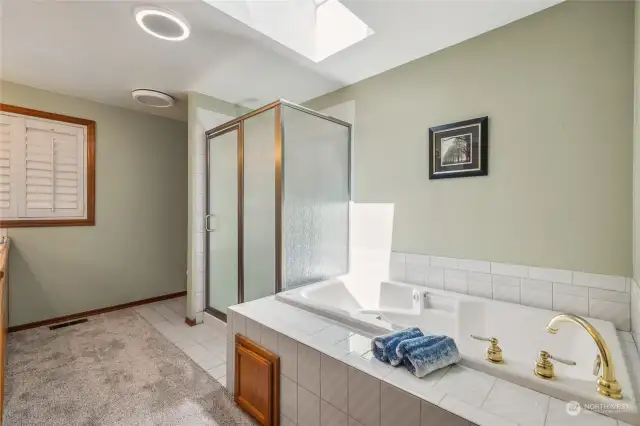 Luxurious primary bathroom with jetted tub