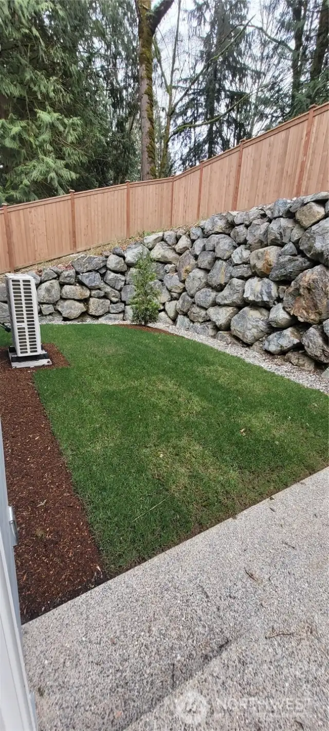 Backyard fenced and landscaped