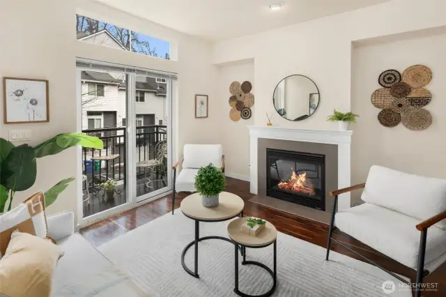 Gas Fireplace with charming balcony inviting natural light.