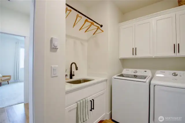 Laundry room with wash basin and storage closet (not shown)