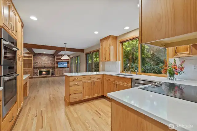This stunning new kitchen boasts sleek soft-close cabinets with sparkling countertops and stainless appliances.
