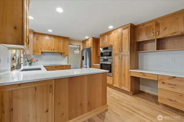 The generous kitchen space provides plenty of room for food preparation and storage.