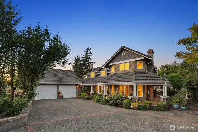 This custom built residence offers a private drive & breezeway access to detached 2-car garage. Designed w/an emphasis on style & elegance while maximizing effortless living. Monier tiled roof, cedar siding, wrap-around porch w/ Brazilian walnut, stone pillars w/concrete caps & cobblestone pathways leading to the lower gardens, this home features attention to every detail.