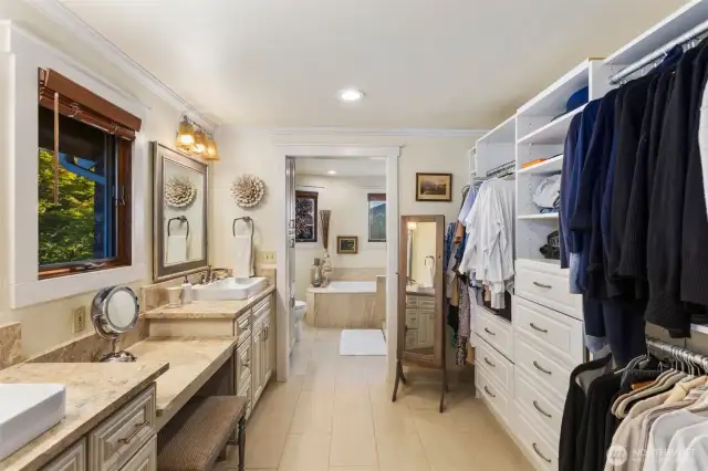Large 5-piece bath w/custom built in vanity, tile floors, soaking tub, large walk in tile surround shower offering seamless customized design.
