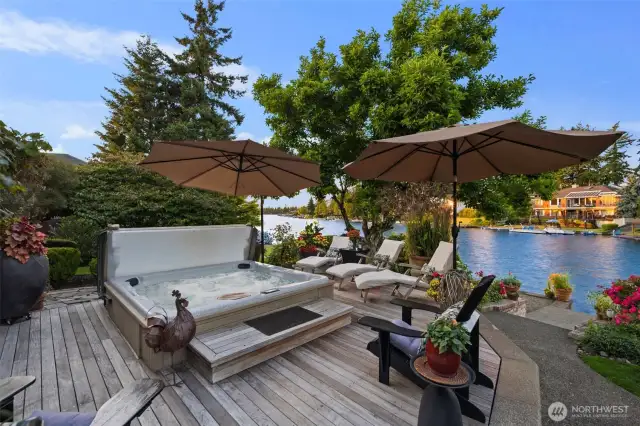 Built in spa surrounded by custom Brazilian walnut decking overlooking breathtaking lake & mountain views.