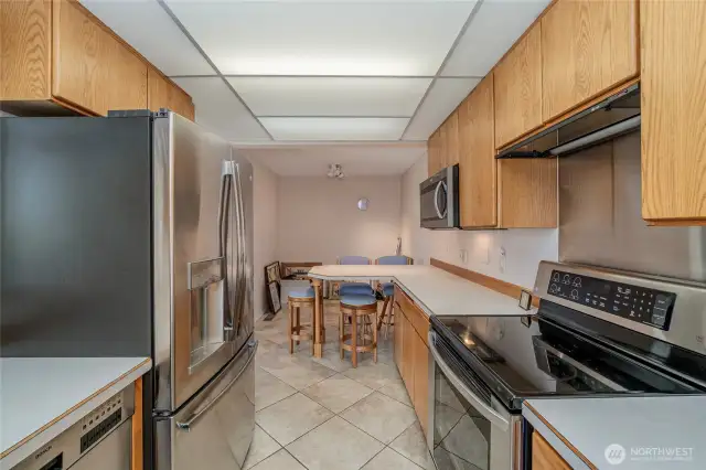 Kitchen looking to Breakfast bar and Nook behind