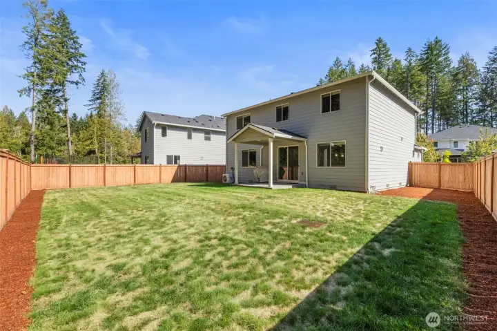 Large fully fenced backyard.