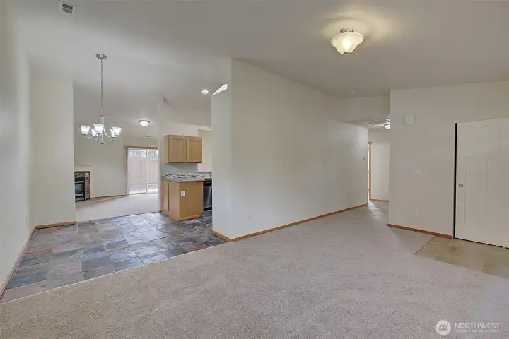 View Towards Dining Area with New Carpet Throughout the Home