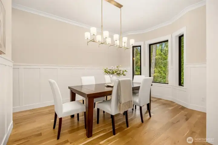 Dining room located off the entry foyer: Large bay window overlooks gorgeous front landscaping, Butler’s pantry with quartz counters and full wall of cabinetry, Wide plank white oak floors