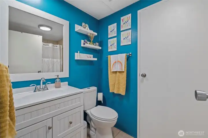 Guest bedroom with door to laundry