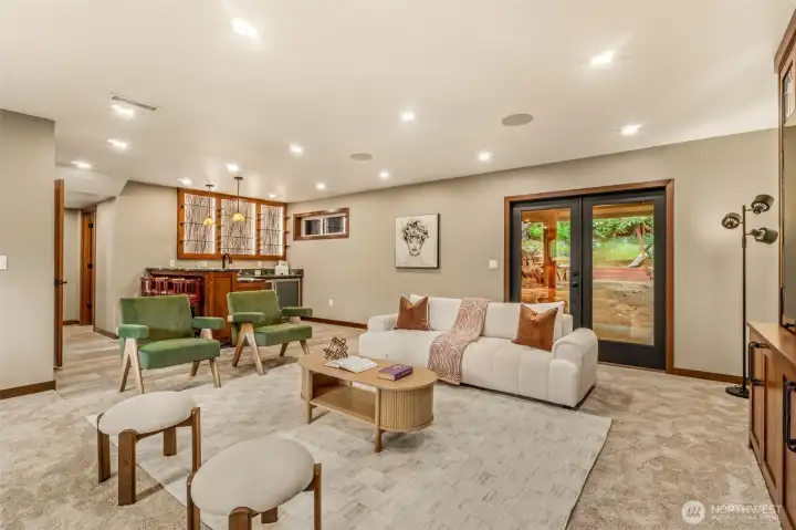 Freshly painted double doors leading out to a TV area w/ wired in heaters!  WET bar in the back of this room w/ more CUSTOM lighted built ins.