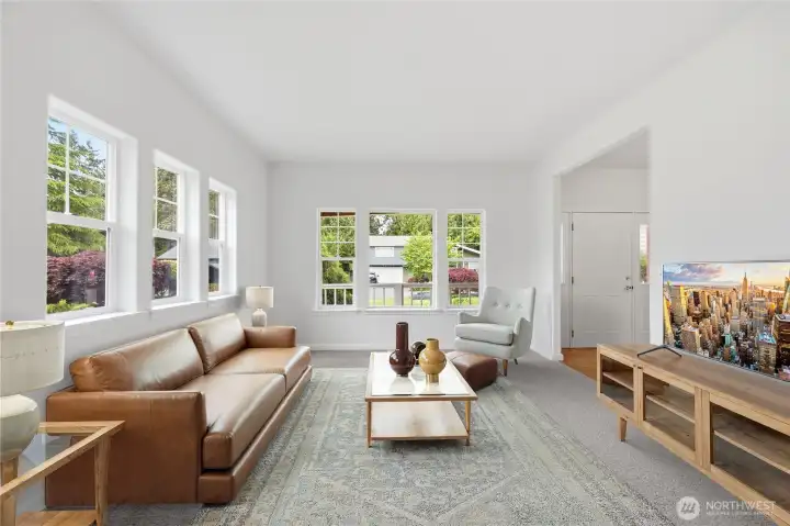 The formal living area is virtually staged.
