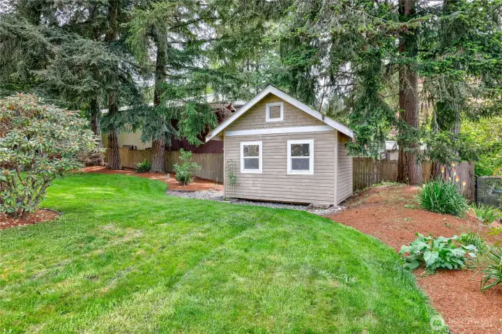 This sweet garden cottage adds so much charm to this wonderful property!