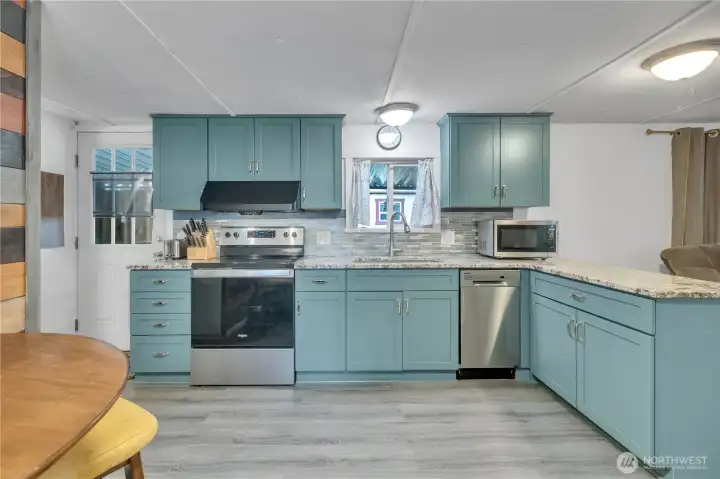 Remodeled kitchen, with new shaker style cabinets, & stainless steel appliances ~