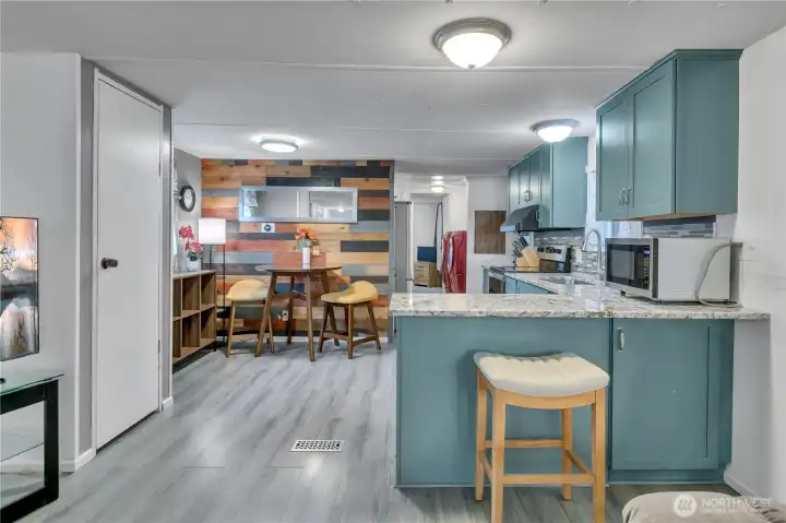 Cute dining area with wood accent wall ~