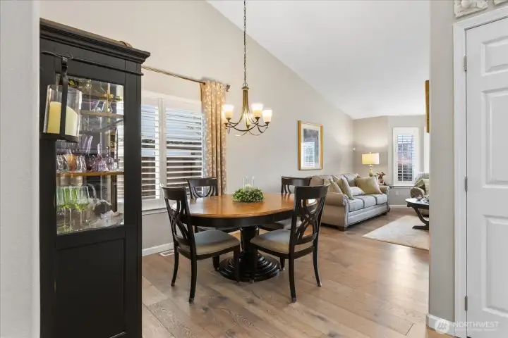 Spacious dining area w/ vaulted ceilings, abundant natural light, & seamless flow into the living spaces.