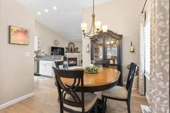 Open dining space perfectly positioned for entertaining w/ easy access to the kitchen & family room.