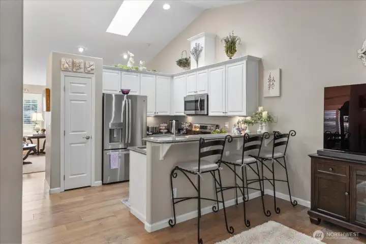 Breakfast bar seating creates the perfect spot for casual dining, conversation, or entertaining guests.