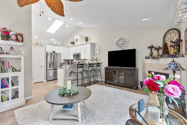 Open-concept great room seamlessly connects the kitchen, dining, & living areas—ideal for everyday living & entertaining.