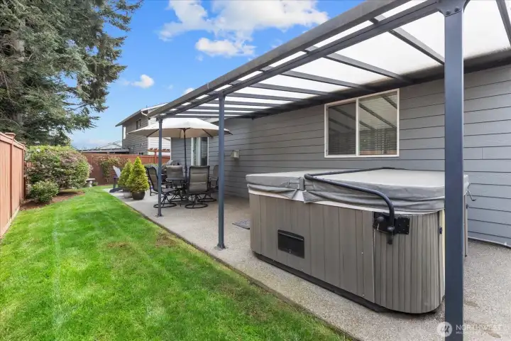 Extended covered outdoor living area creates the perfect space for dining, entertaining, or enjoying peaceful mornings outdoors.