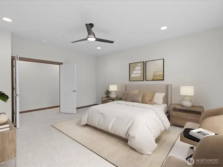 Generous primary ensuite bedroom showcasing a contemporary ceiling fan, clean lines, and beautiful French doors.