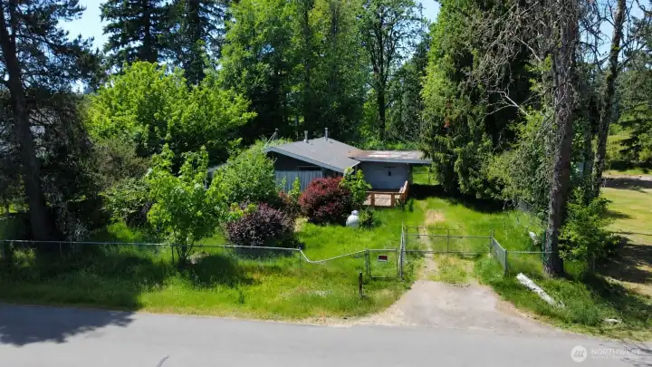 This spacious lot is fenced with mature landscaping