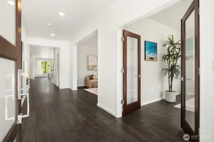 Welcoming entry opens to wide-plank flooring, flexible living spaces, and a dedicated main-level office.