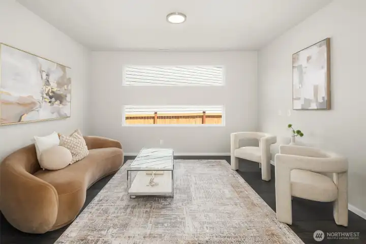 Flexible main-level room ideal for a den, office, media space, or sitting area, clean architectural lines.