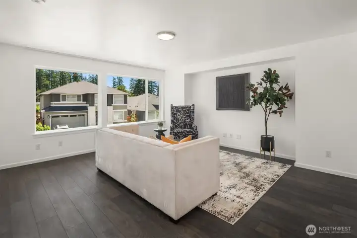 Upper-level leisure room provides a comfortable flex space for movie nights, homework, gaming, or a quiet second lounge away from the main living area.