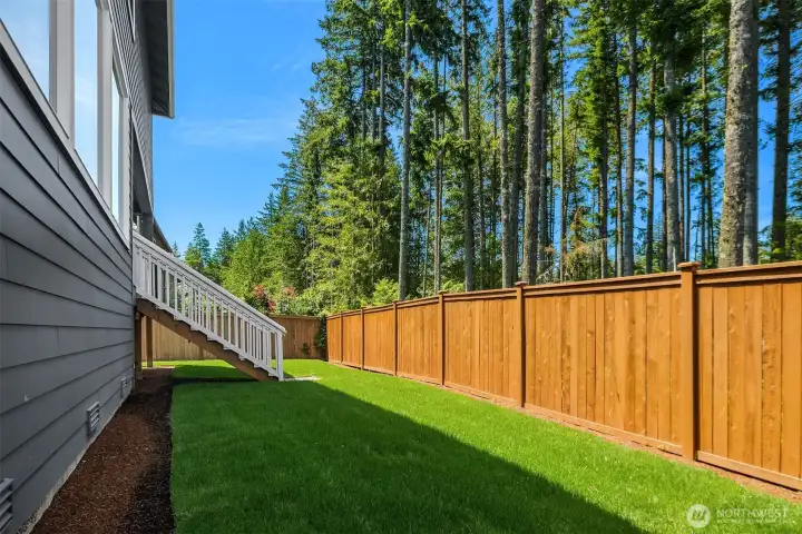 Private fenced yard backs to mature native trees, offering a peaceful greenbelt setting within an established McCormick community neighborhood.