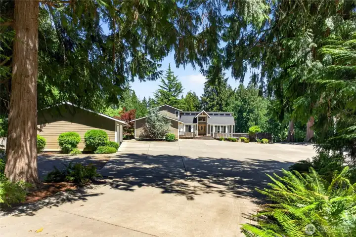 Gated Snag Island leads to the private 2.7 acres featuring detached garages and ample off street parking Gated Snag Island leads to the private 2.7 acres featuring detached garages and ample off street parking