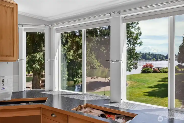 Main floor primary suite features views from every window Main floor primary suite features views from every window