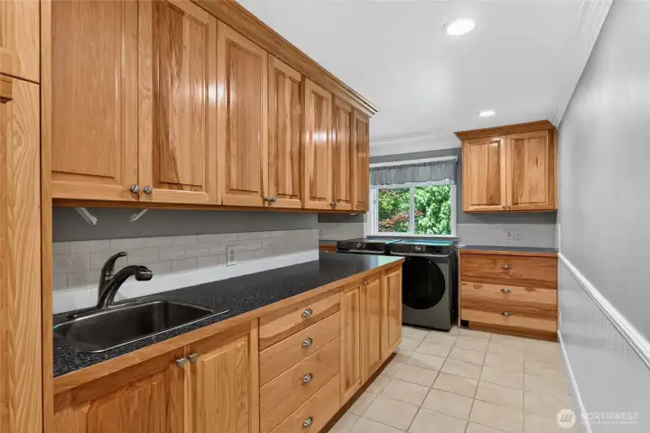 Main floor laundry room offers space for washing and folding Main floor laundry room offers space for washing and folding