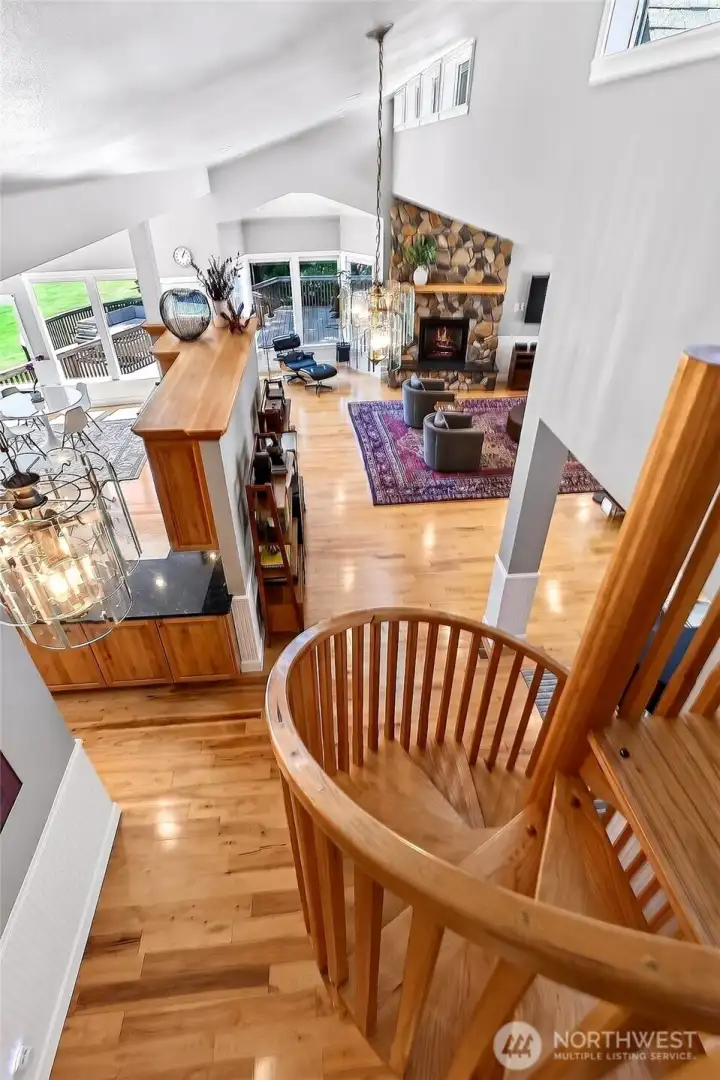 The spiral staircase leads to huge bonus room/media room with built in and wetbar and a private office set up with cabinets and built in desk The spiral staircase leads to huge bonus room/media room with built in and wetbar and a private office set up with cabinets and built in desk