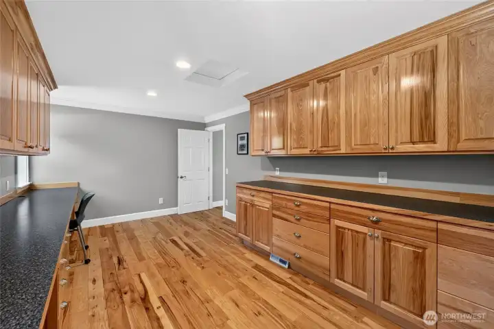 Private office upstairs featuring built in desk and cabinet storage Private office upstairs featuring built in desk and cabinet storage