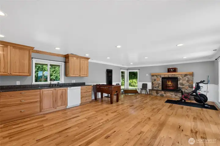 Full kitchen with ample entertaining and rec room space, fireplace and access to the outdoors Full kitchen with ample entertaining and rec room space, fireplace and access to the outdoors