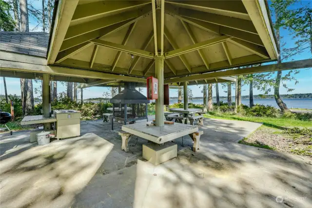 Cabana by the beach with picnic tables