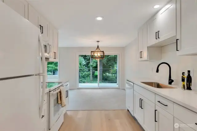 kitchen opens to dining area and overlooks private covered deck.