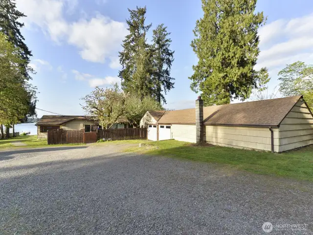 Head down the driveway toward the lake.  1200 sq ft shop on right, house in center