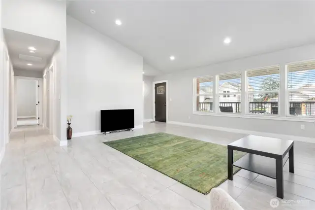 Living room has a vaulted ceiling