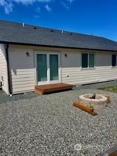 Firepit and low-maintenance lawn in the backyard