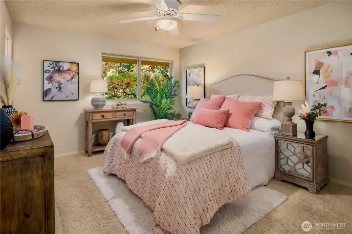 A soft and inviting primary dressed in warm tones and natural textures - the perfect place to unwind after a long day.
