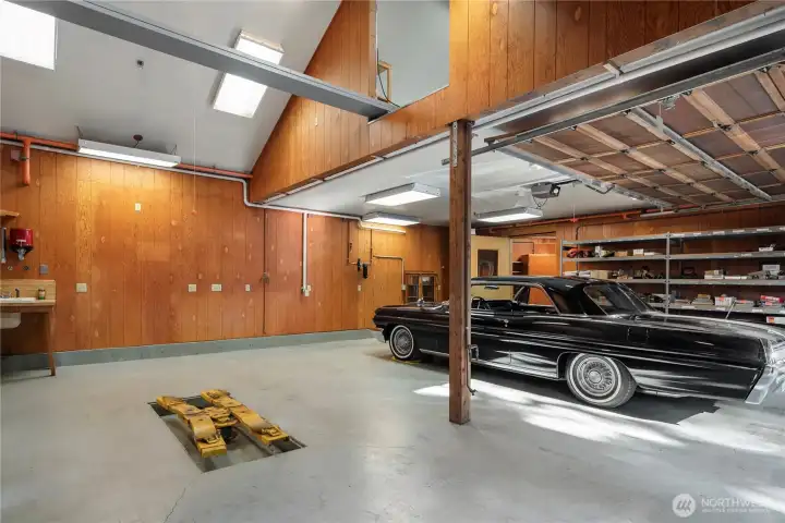 A truly extraordinary space, equally suited to restoration, artistry, or craftsmanship. A half ton hoist for the mechanic enthusiast and large loft space above - all kinds of potential.