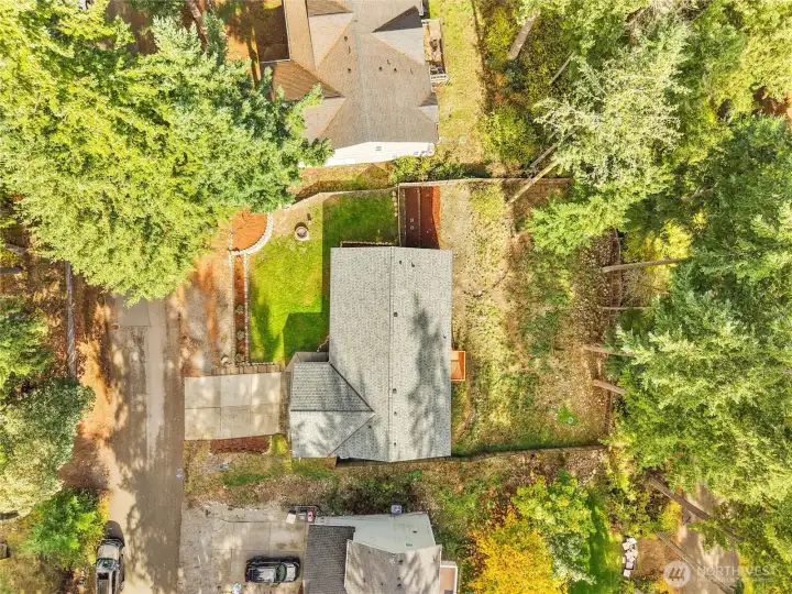 Aerial view highlights the home’s spacious lot and surrounding community amenities.