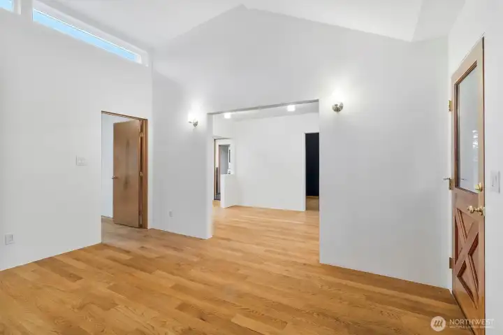 Spacious living area with open flow to dining and kitchen