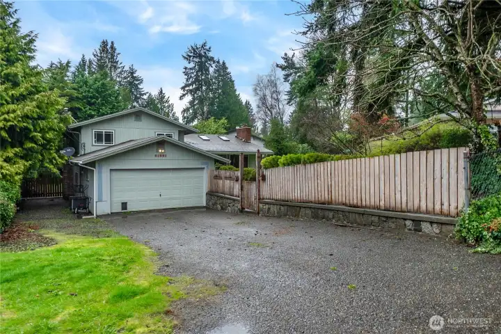 Long driveway with additional parking to the left