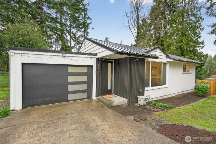 Completely renovated Shoreline rambler showcasing a studs-out transformation on nearly one-fifth acre, featuring modern finishes throughout this single-level 780-square-foot home with no HOA fees.