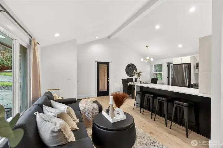 Open floor plan connects kitchen, dining, and living areas seamlessly, maximizing the functional living space within this efficiently designed single-level Shoreline home.