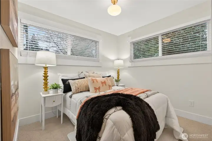 Spacious primary bedroom with abundant natural light.