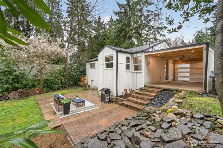 Hard surface patio extends living space outdoors, perfect for summer entertaining on this expansive nearly one-fifth acre lot just blocks from Bitter Lake Reservoir Park.